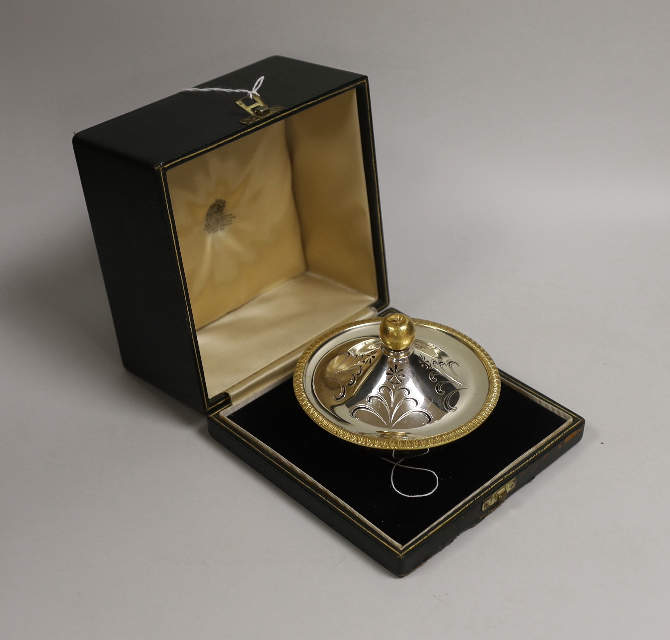 An Elizabeth II Asprey & Co parcel gilt silver circular pomander, with apple finial, diameter 12.5cm, London, 1966, 11oz, in original fitted Asprey & Co case.